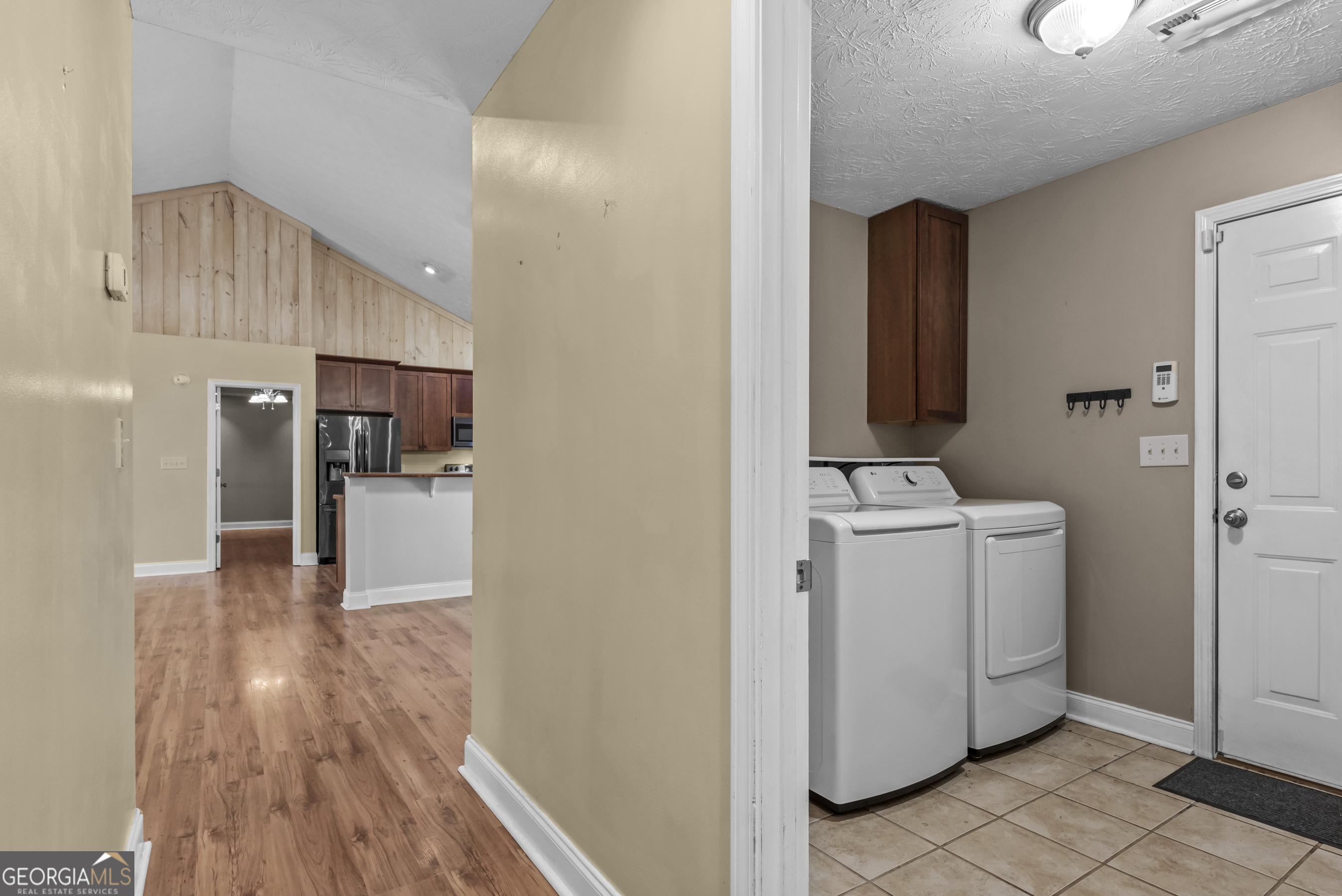 384 Scuffleboro Road Southeast Eatonton, GA 31024 - Photo 32 of 48 a view of storage and utility room with wooden floor