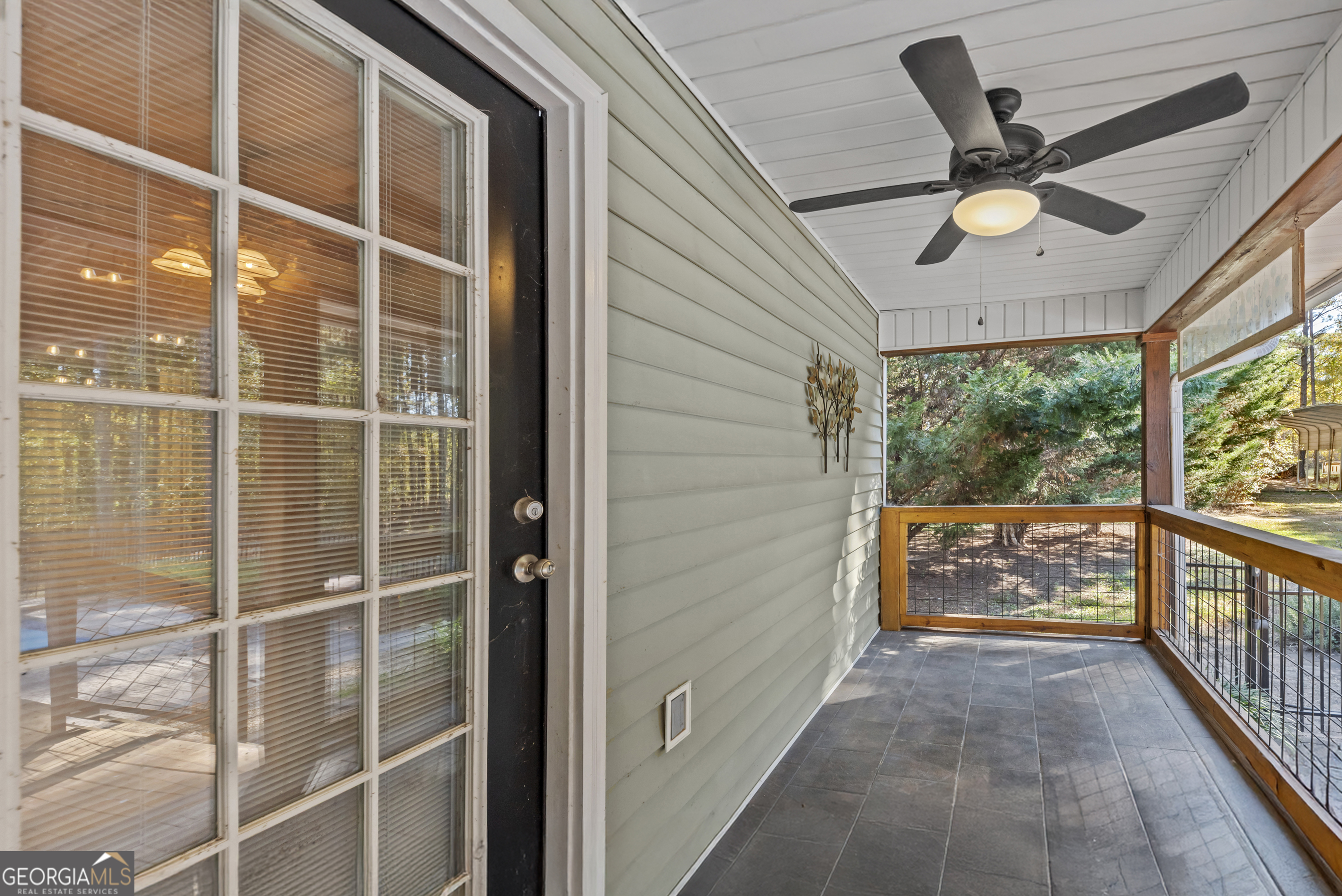 384 Scuffleboro Road Southeast Eatonton, GA 31024 - Photo 37 of 48 a view of a balcony with a ceiling fan