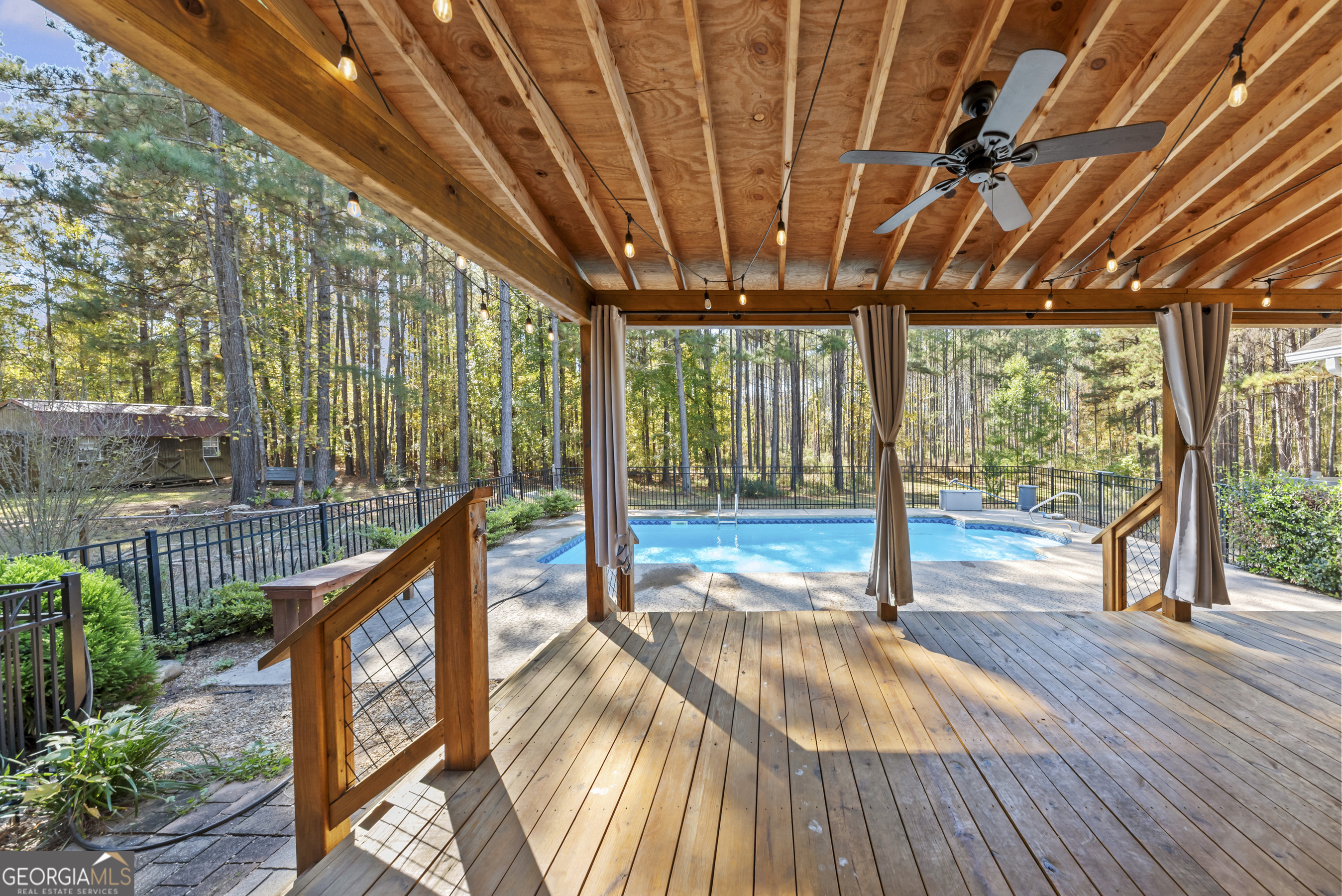 384 Scuffleboro Road Southeast Eatonton, GA 31024 - Photo 38 of 48 a view of swimming pool with wooden deck
