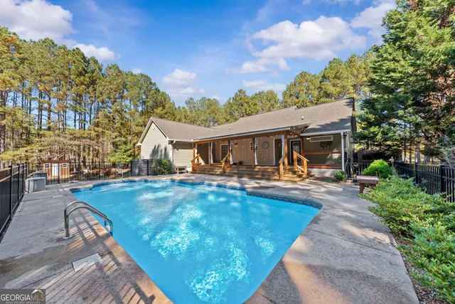 a front view of house with yard and outdoor seating
