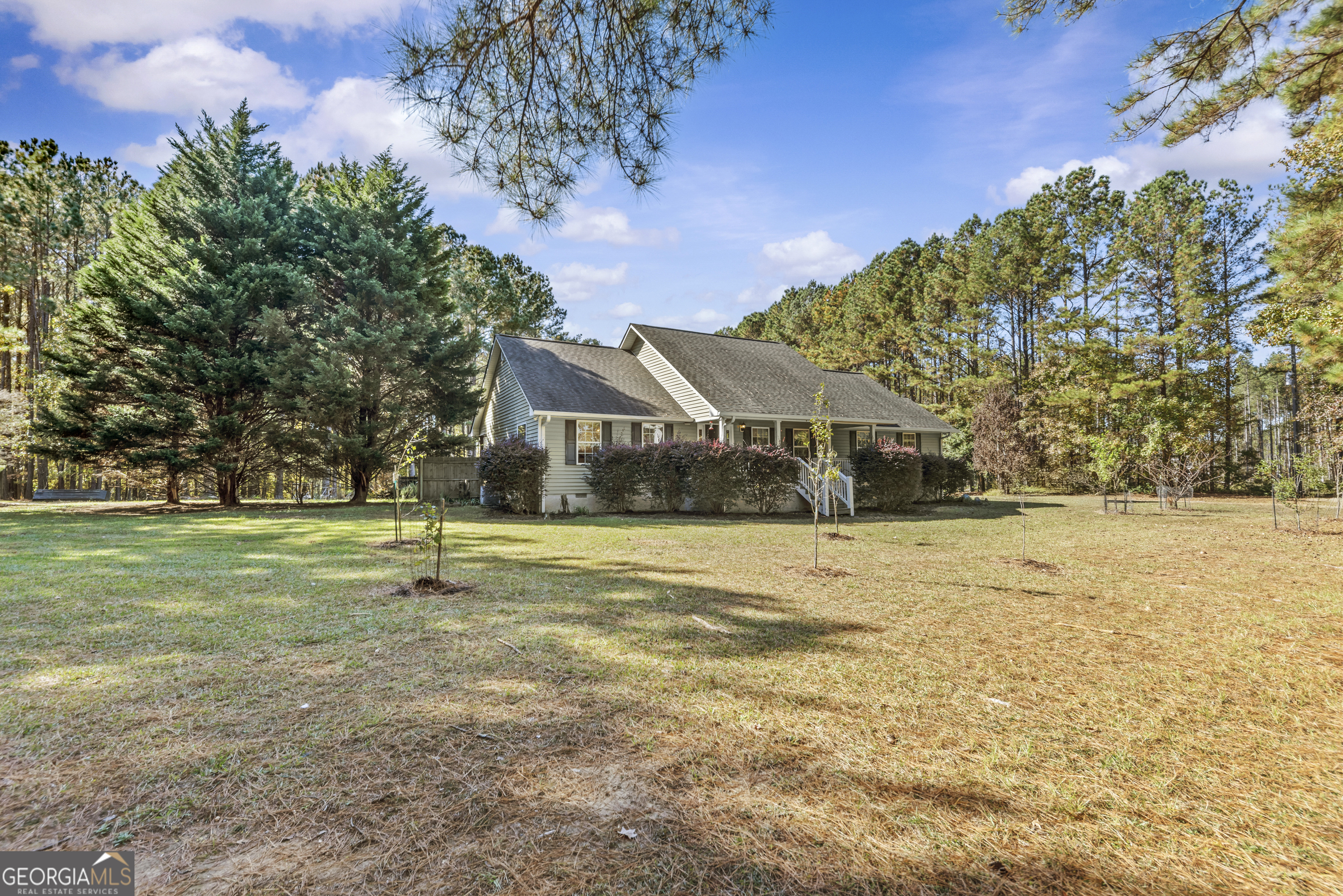 384 Scuffleboro Road Southeast Eatonton, GA 31024 - Photo 4 of 48 a view of swimming pool and trees in the background