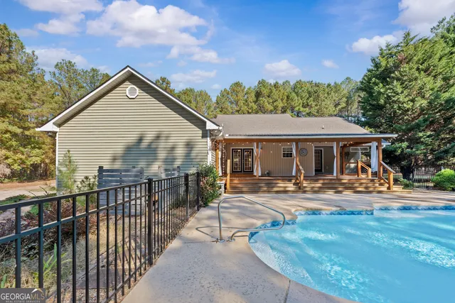 a front view of house with yard outdoor seating and barbeque oven