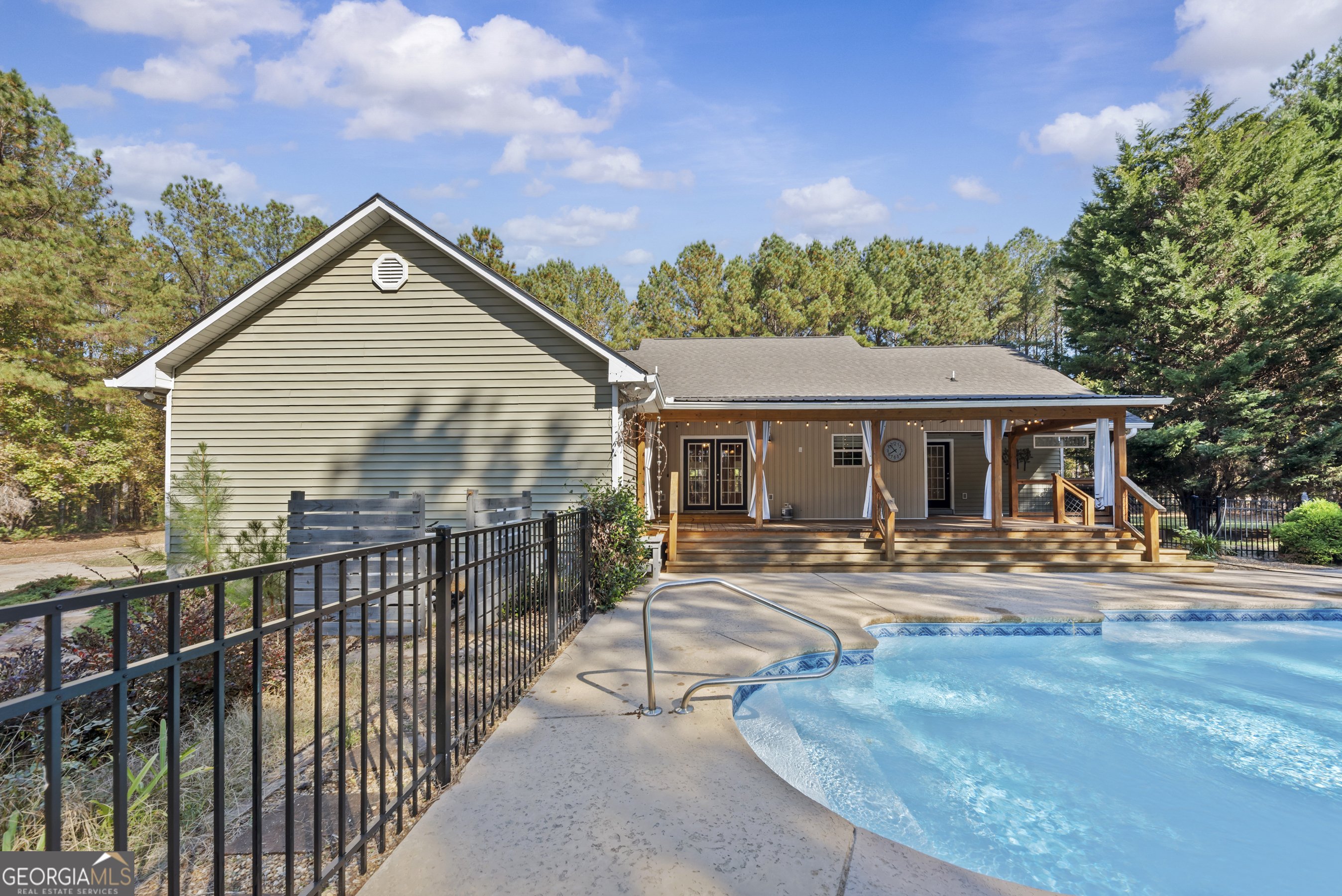 384 Scuffleboro Road Southeast Eatonton, GA 31024 - Photo 41 of 48 a front view of house with yard outdoor seating and barbeque oven