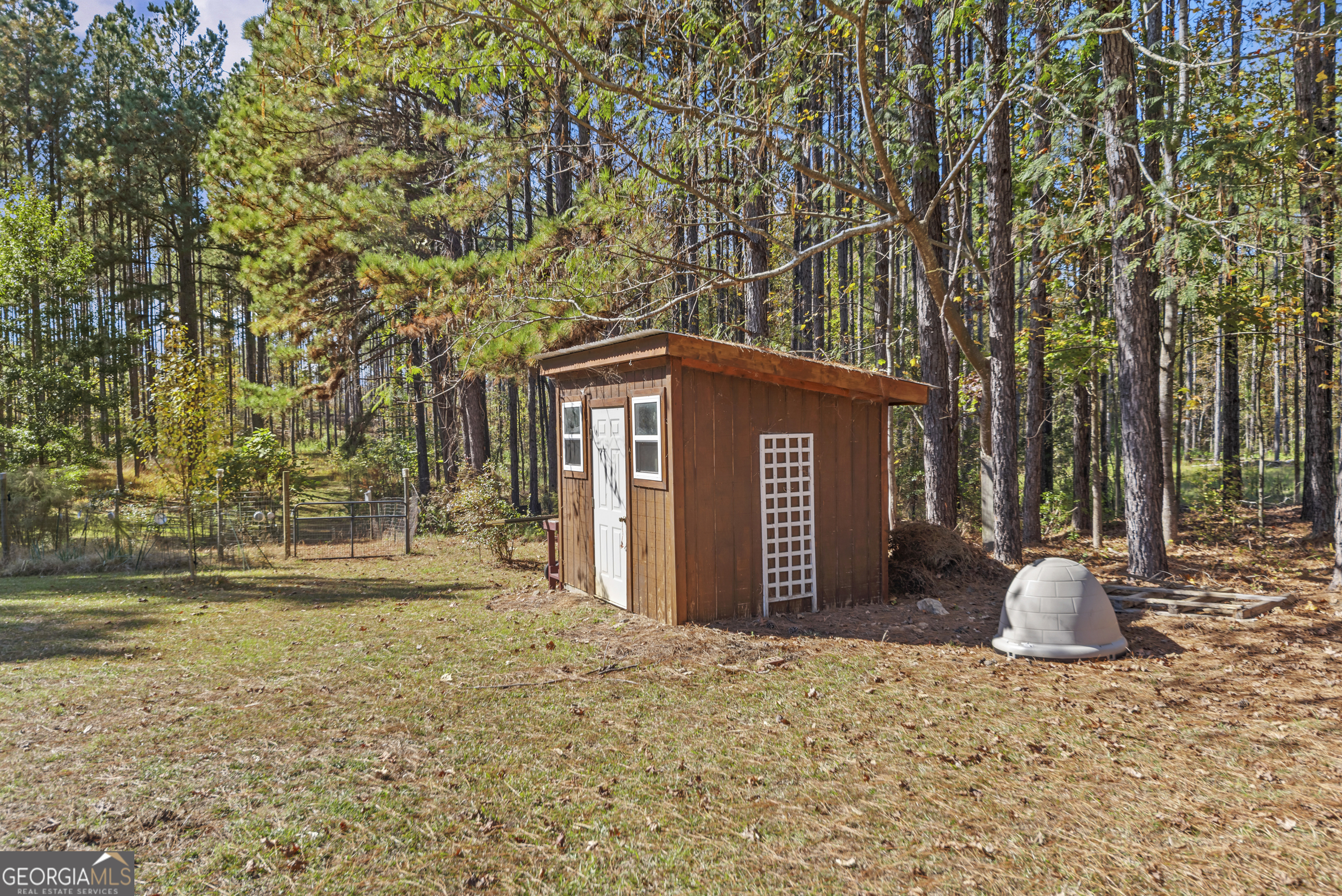 384 Scuffleboro Road Southeast Eatonton, GA 31024 - Photo 46 of 48 a view of a house with backyard and tree