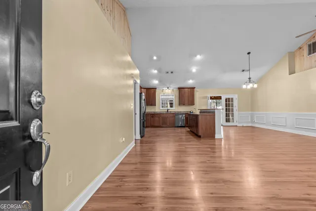a view of a kitchen with a sink and cabinet