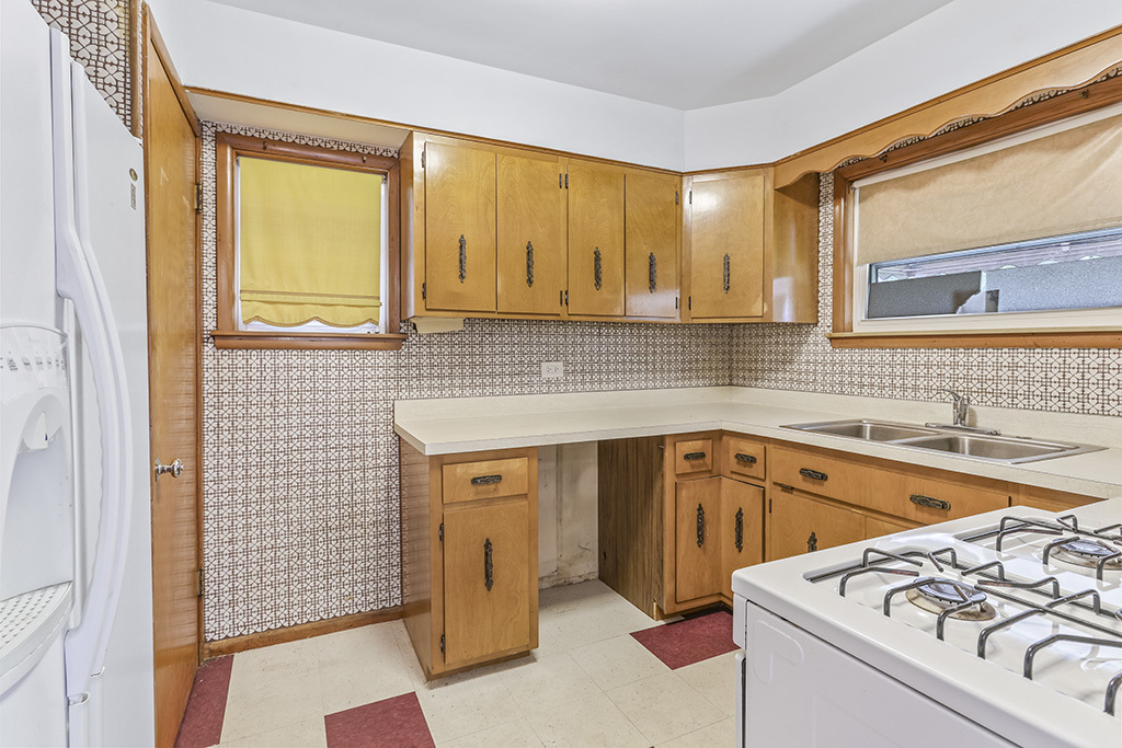 1120 183rd Street Homewood, IL 60430 - Photo 5 of 17 a kitchen with a sink stove and cabinets