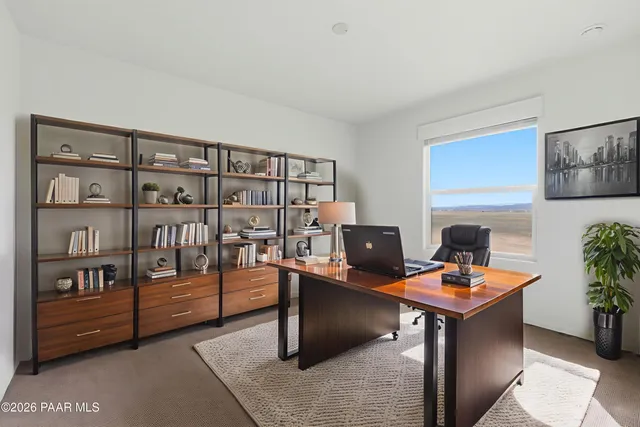 a workspace with furniture and book shelf