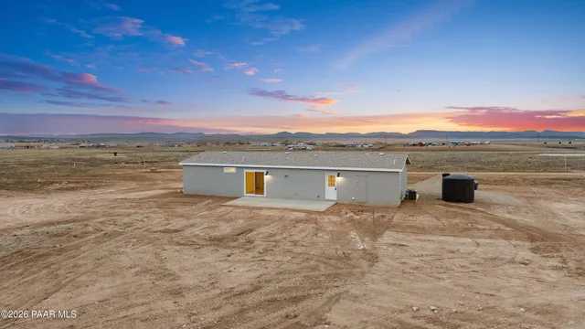 a view of ocean with a mountain