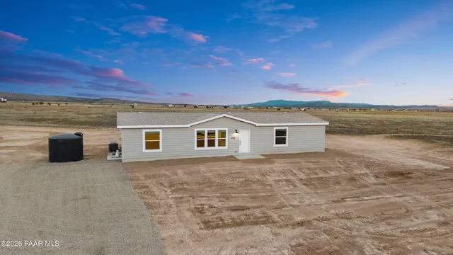 a backyard of a house with a yard