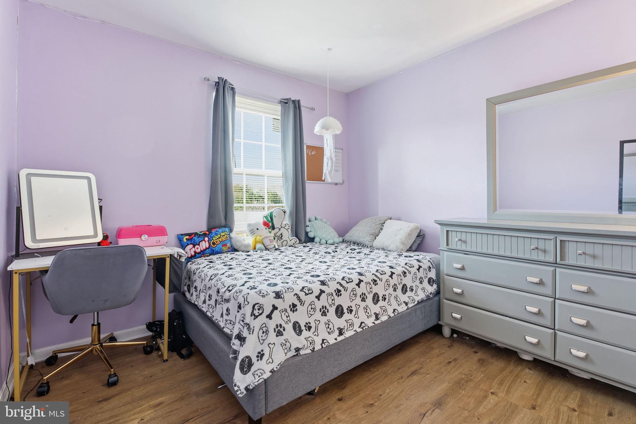 9300 Ridings Way Laurel, MD 20723 - Photo 15 of 24 a bedroom with a bed chair and dresser