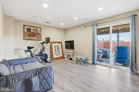 a bed room with furniture and a flat screen tv