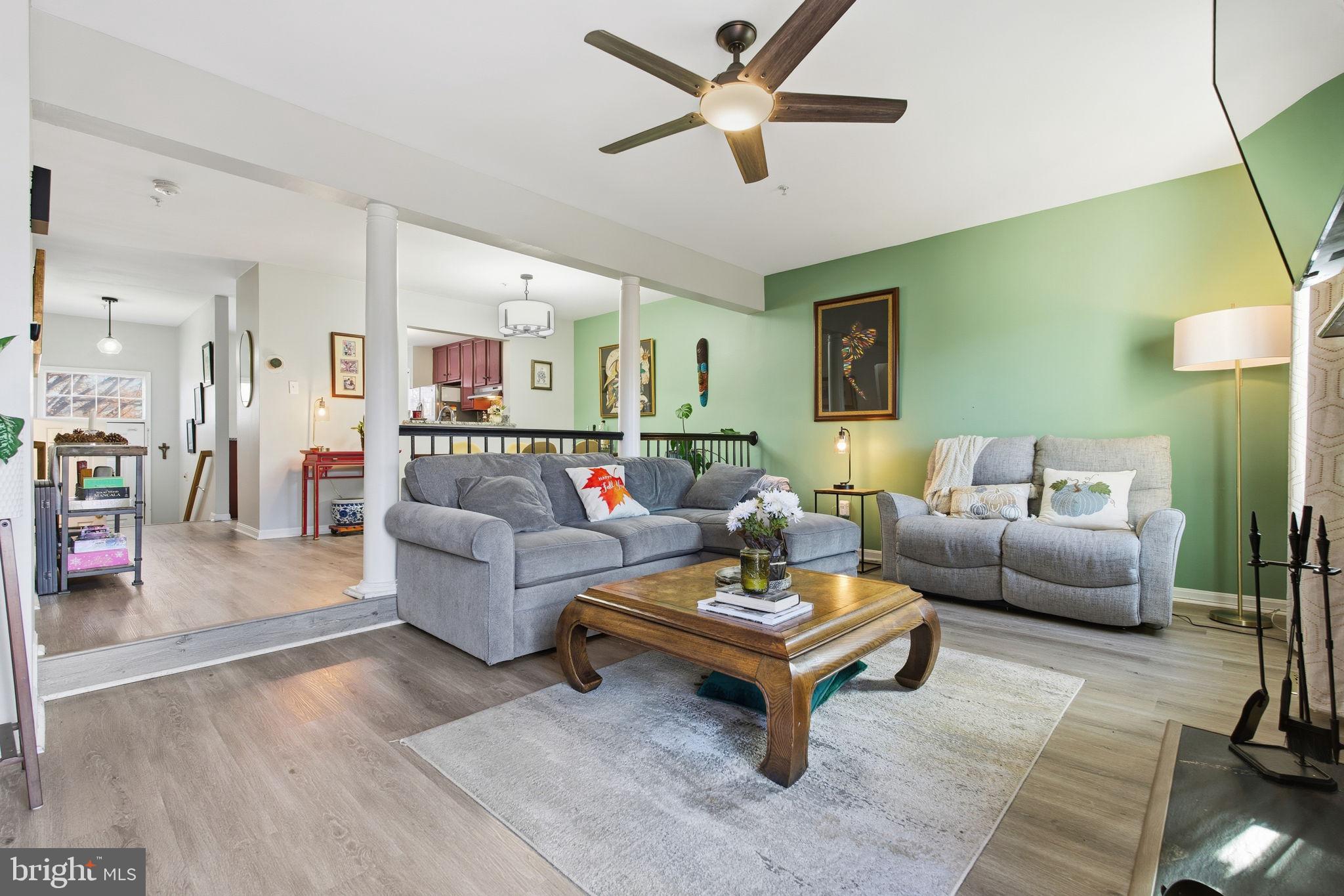 9300 Ridings Way Laurel, MD 20723 - Photo 2 of 24 a living room with furniture and a wooden floor