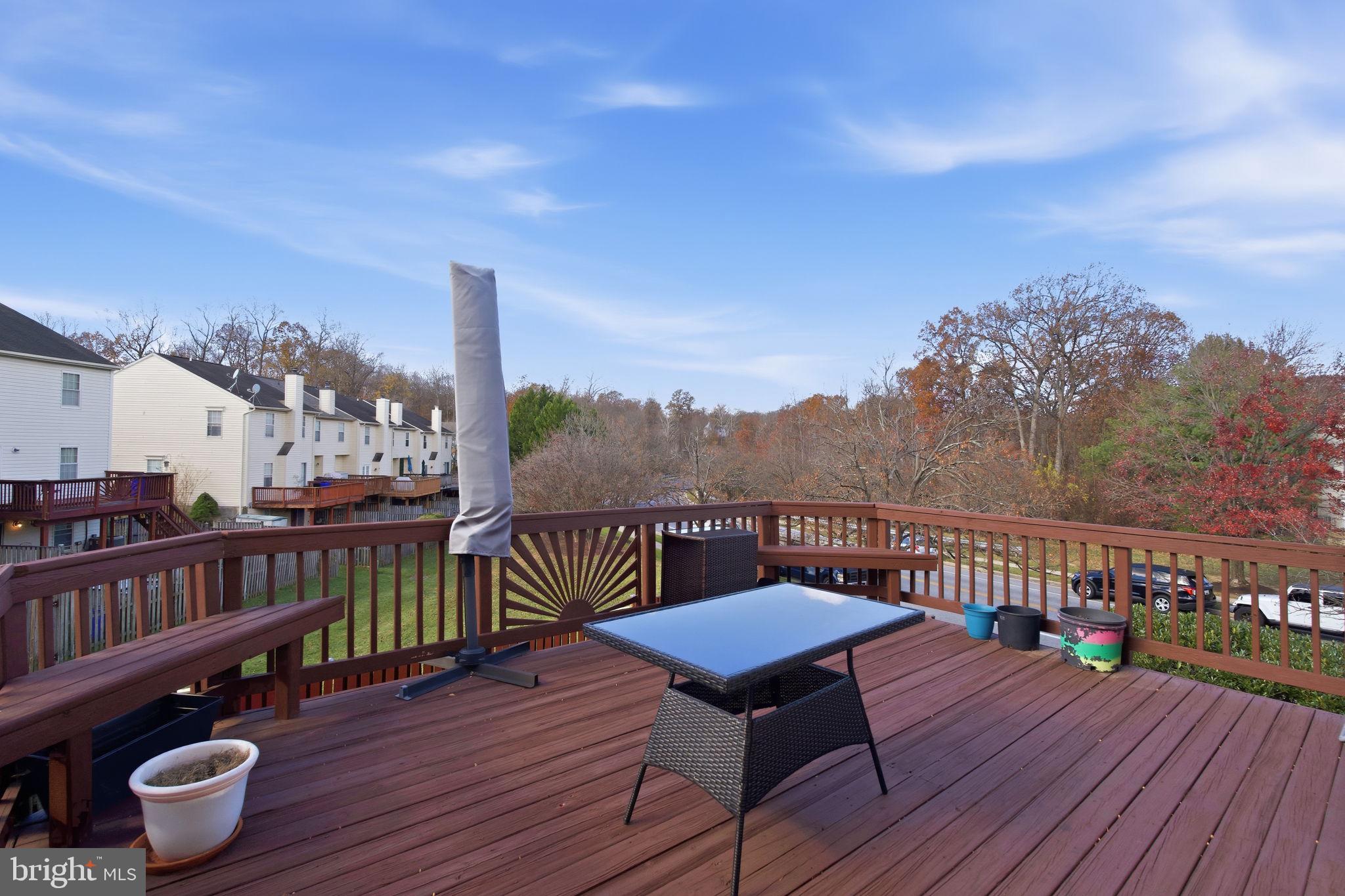 9300 Ridings Way Laurel, MD 20723 - Photo 18 of 24 a view of a chairs on deck with wooden floor