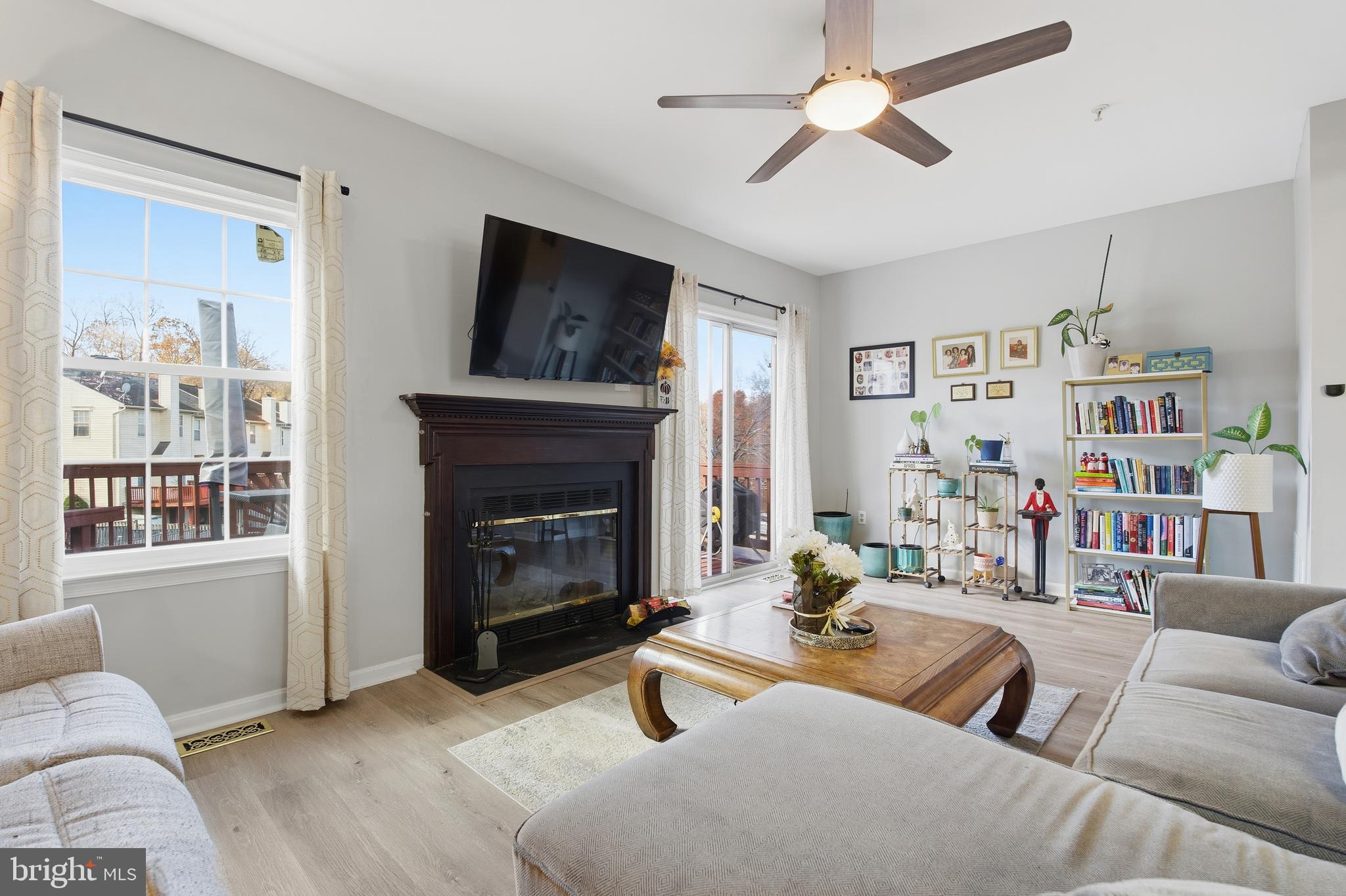 9300 Ridings Way Laurel, MD 20723 - Photo 4 of 24 a living room with furniture a window and a fireplace