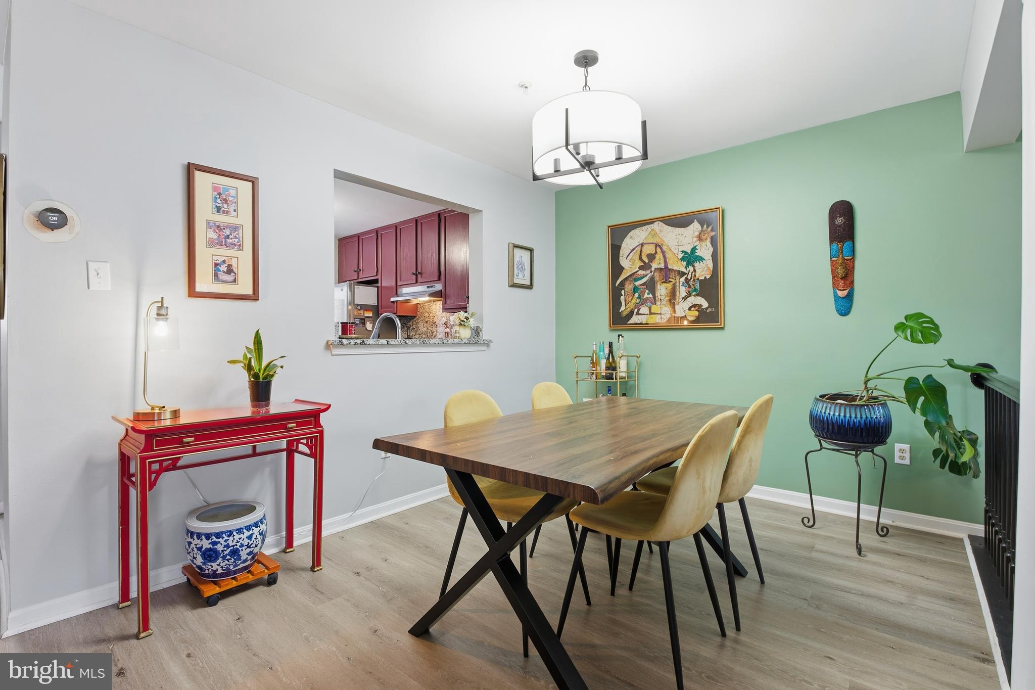9300 Ridings Way Laurel, MD 20723 - Photo 5 of 24 a view of a dining room with furniture and wooden floor