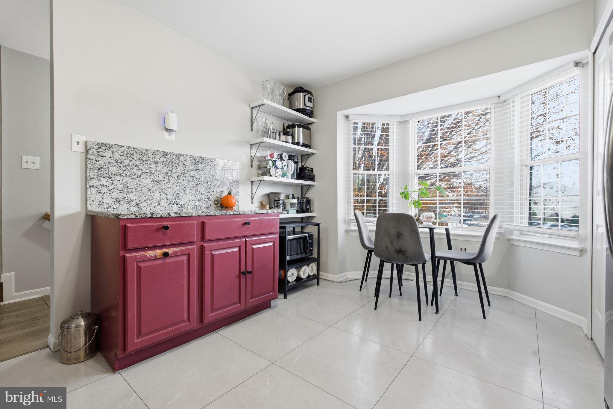 9300 Ridings Way Laurel, MD 20723 - Photo 8 of 24 a view of a dining room with furniture window and outside view