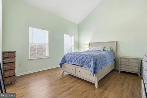 a bedroom with a bed and dresser