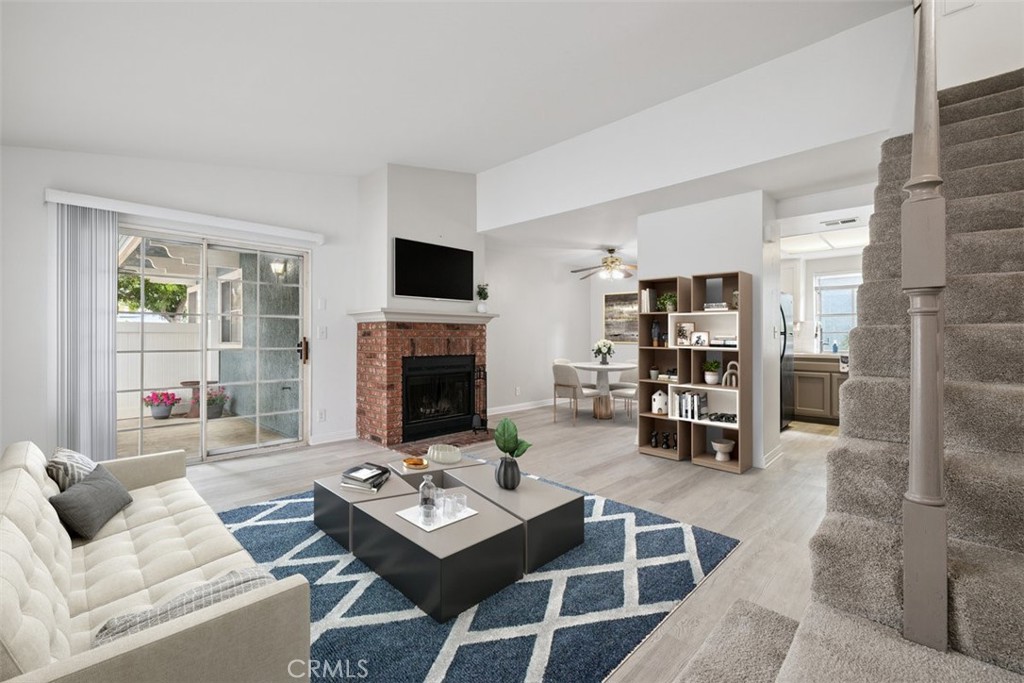 1980 Rory Lane, Unit 1 Simi Valley, CA 93063 - Photo 1 of 1 a living room with furniture a rug and a fireplace
