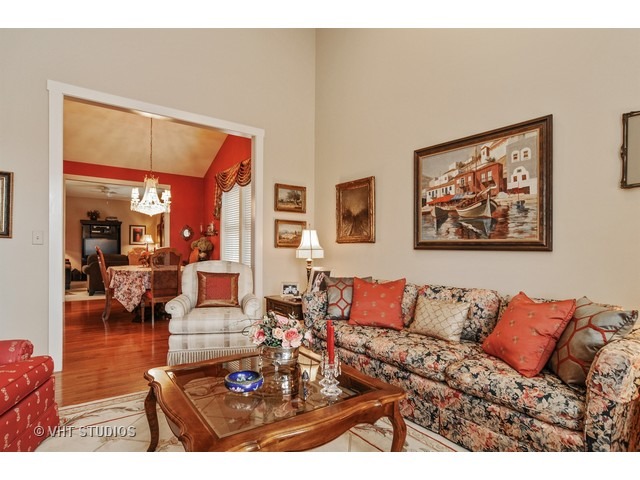 1040 Harris Road Grayslake, IL 60030 - Photo 11 of 24 a living room with furniture a lamp and a dining table