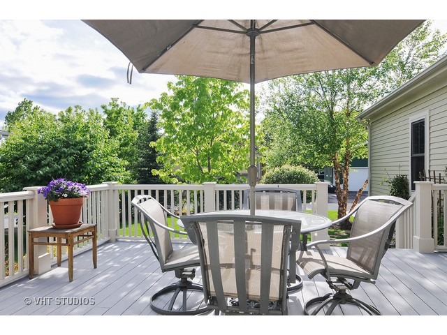 1040 Harris Road Grayslake, IL 60030 - Photo 19 of 24 a view of balcony with furniture and wooden floor