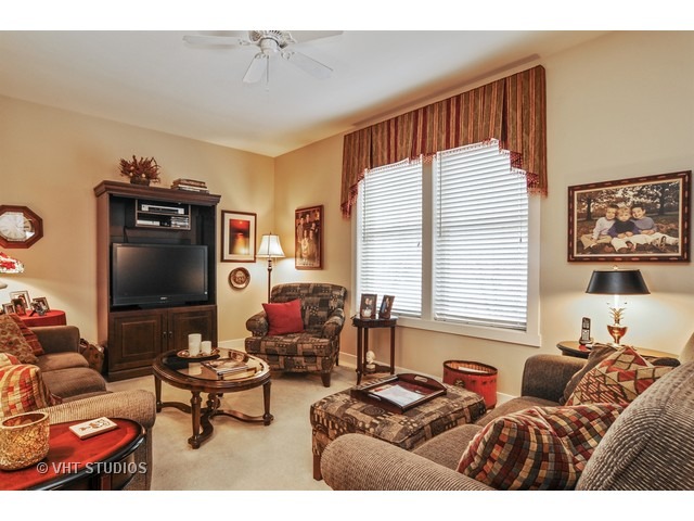 1040 Harris Road Grayslake, IL 60030 - Photo 4 of 24 a living room with furniture and a flat screen tv