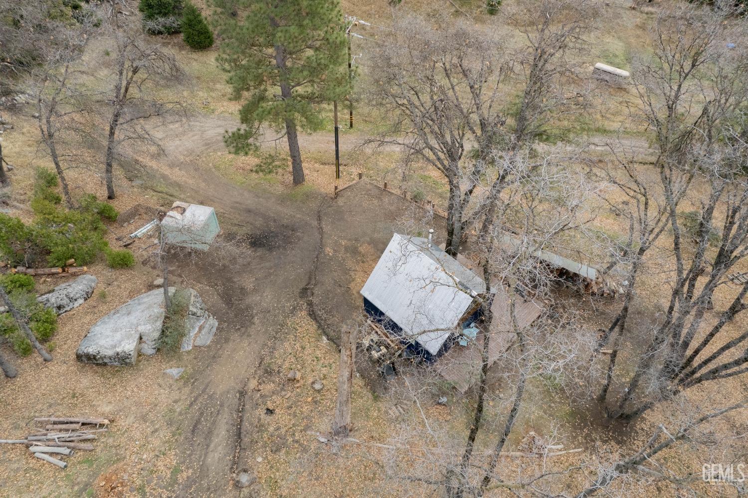 Undisclosed Address Posey, CA 93260 - Photo 13 of 51 a fire pit sitting in the middle of a yard