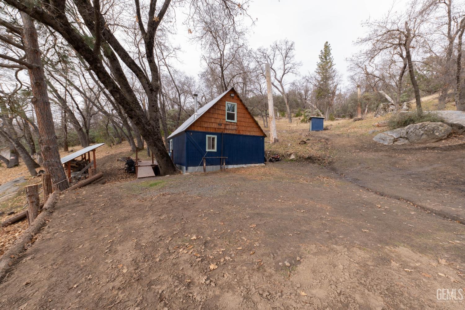Undisclosed Address Posey, CA 93260 - Photo 17 of 51 a house with trees in the background