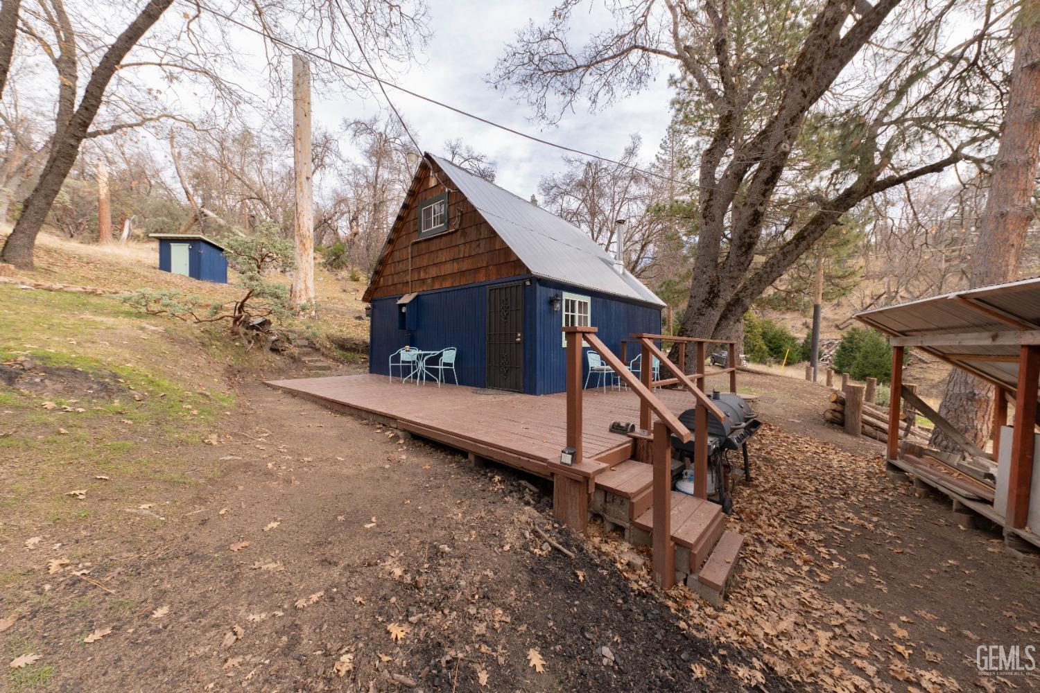 Undisclosed Address Posey, CA 93260 - Photo 20 of 51 a view of a house with a yard covered in snow