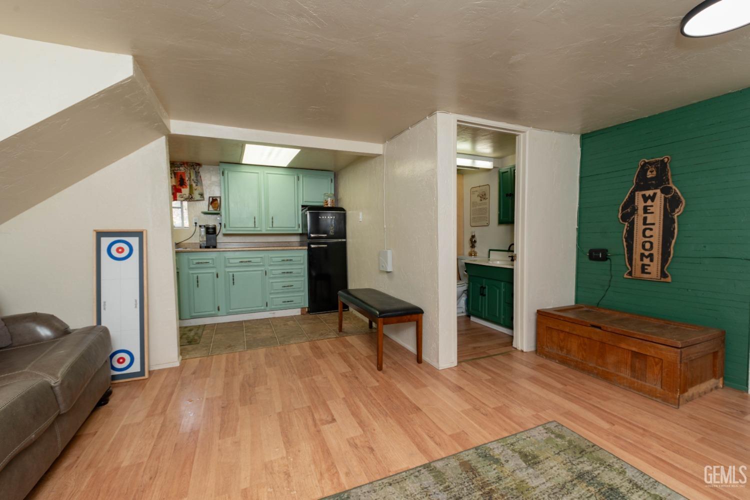 Undisclosed Address Posey, CA 93260 - Photo 36 of 51 a living room with furniture and a wooden floor