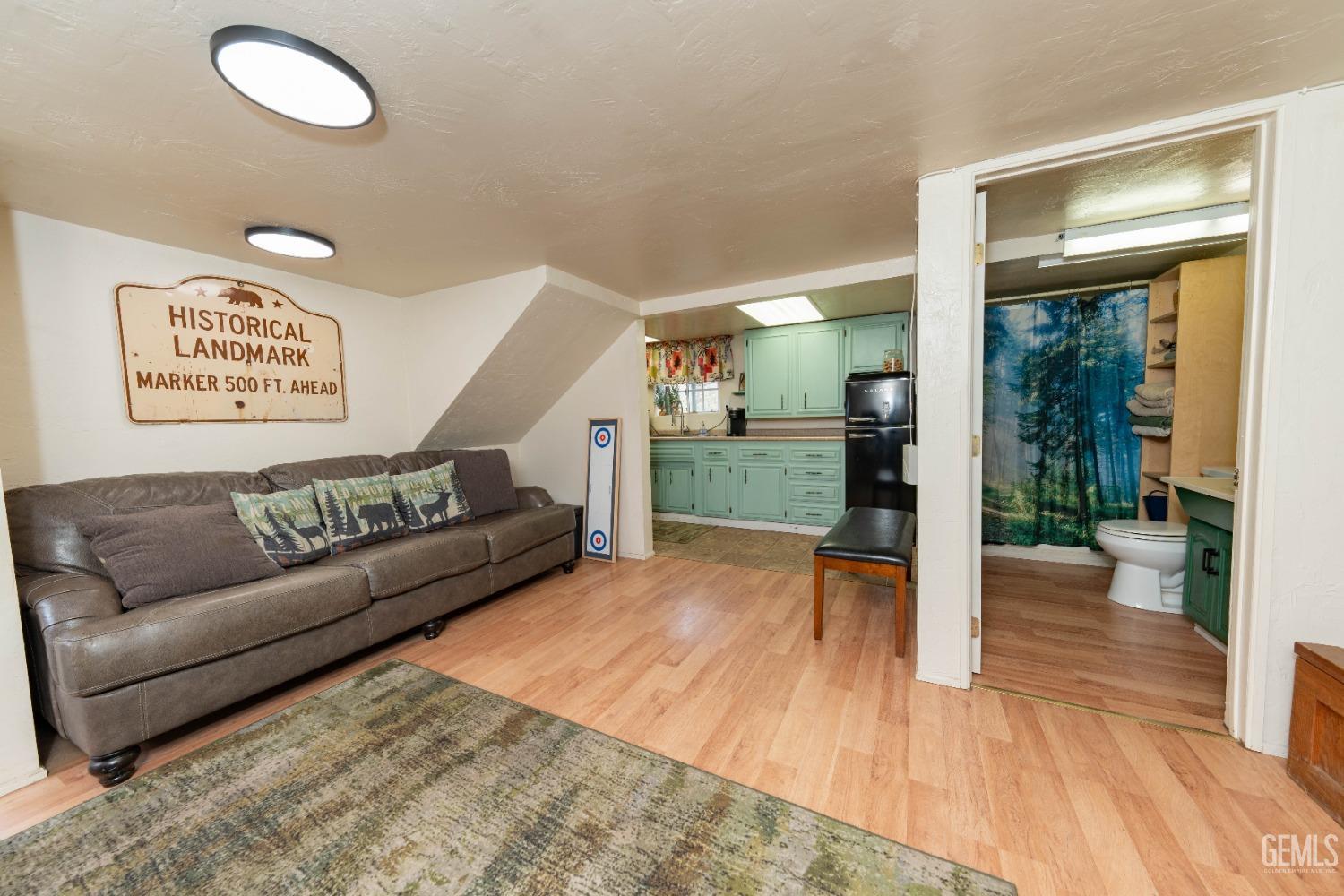 Undisclosed Address Posey, CA 93260 - Photo 37 of 51 a living room with furniture and a wooden floor