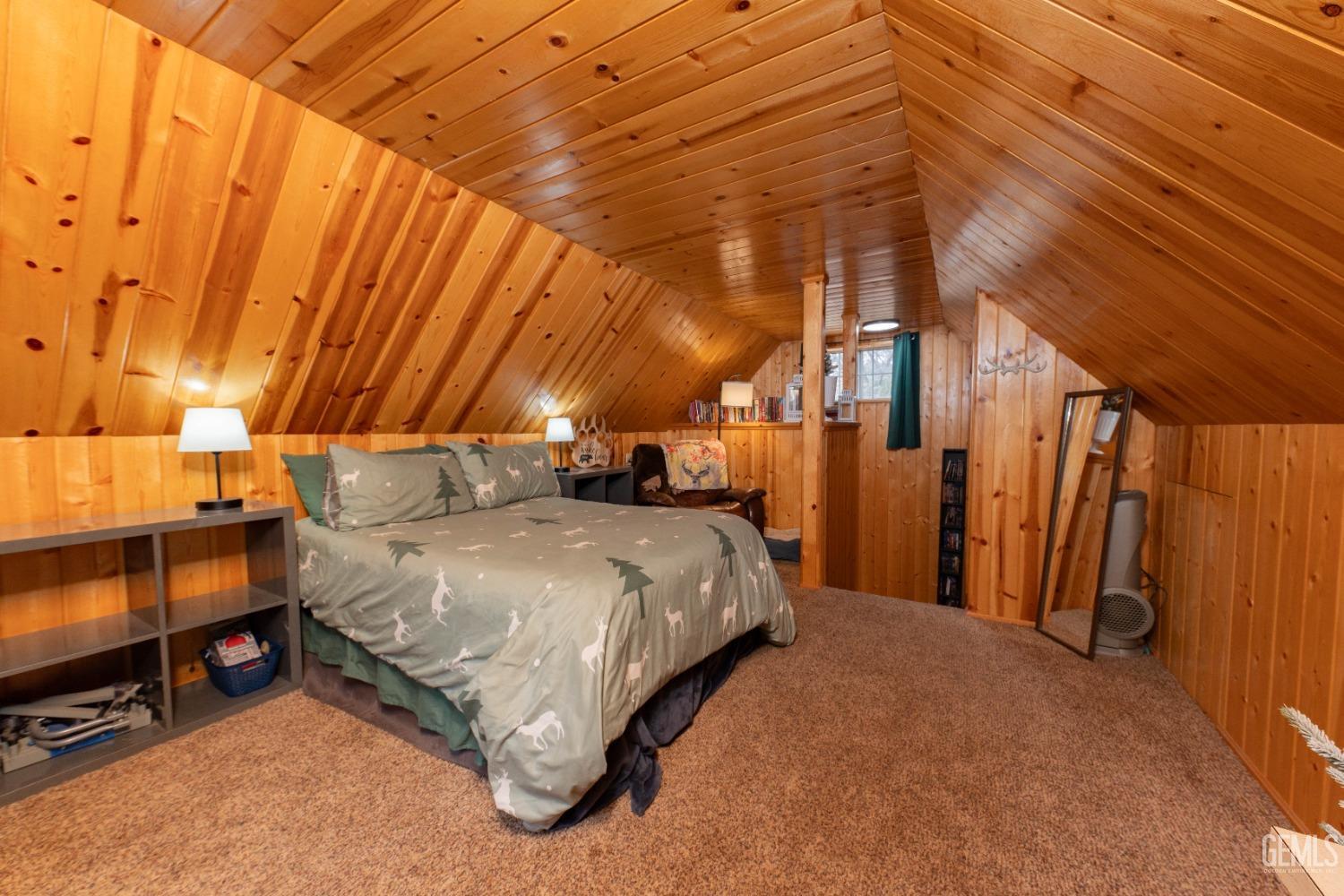 Undisclosed Address Posey, CA 93260 - Photo 46 of 51 a bed sitting in a room next to a chair