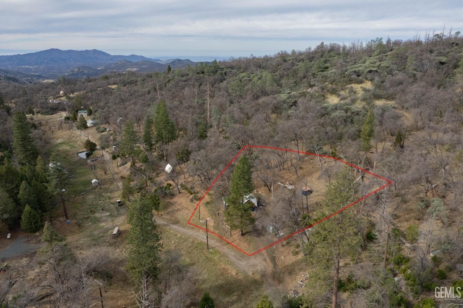 Undisclosed Address Posey, CA 93260 - Photo 5 of 51 a view of a city with lush green forest