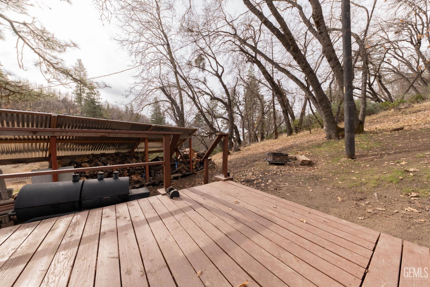 Undisclosed Address Posey, CA 93260 - Photo 51 of 51 a view of backyard space with wooden deck