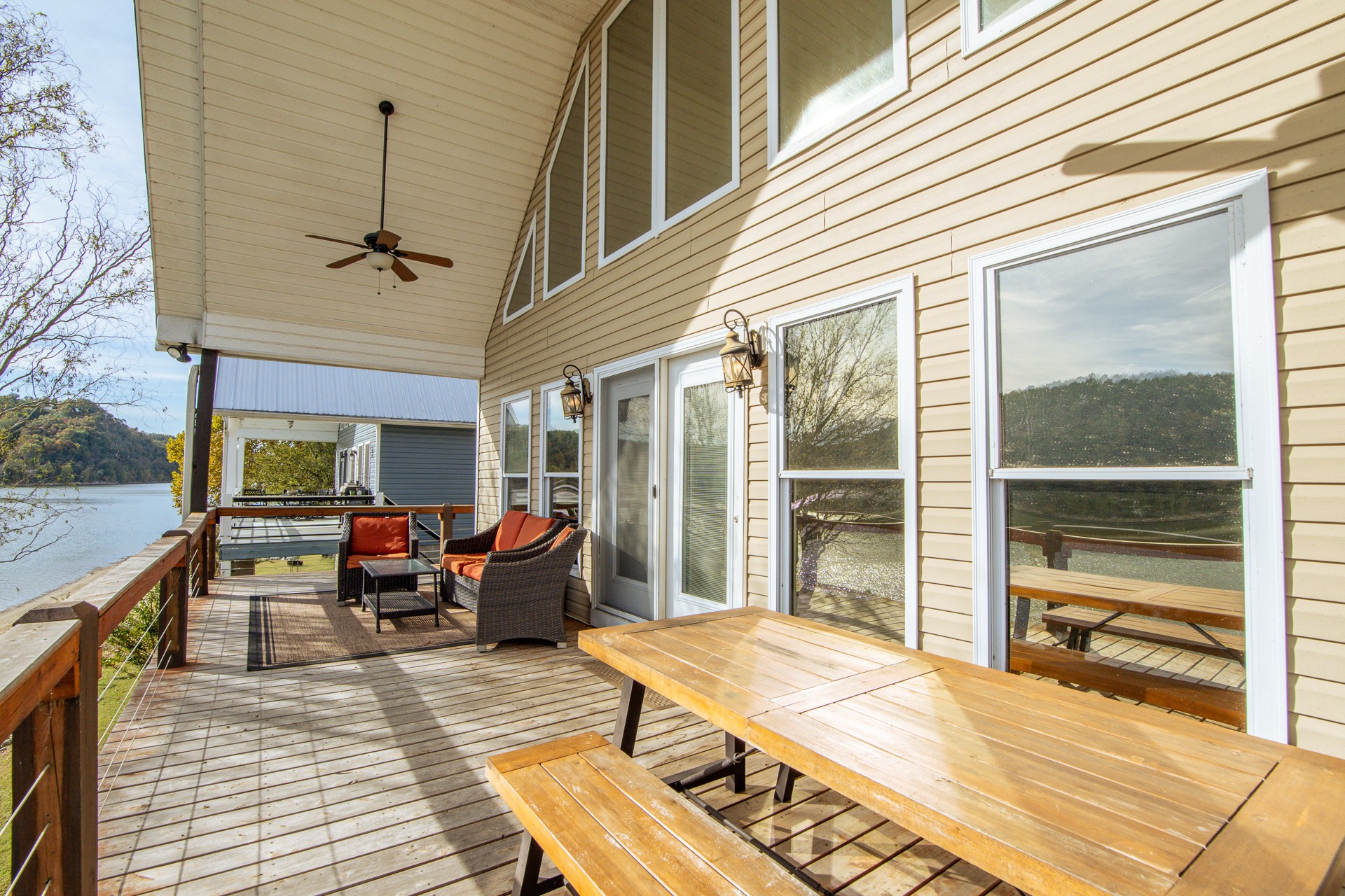 a living room with patio furniture and a fireplace