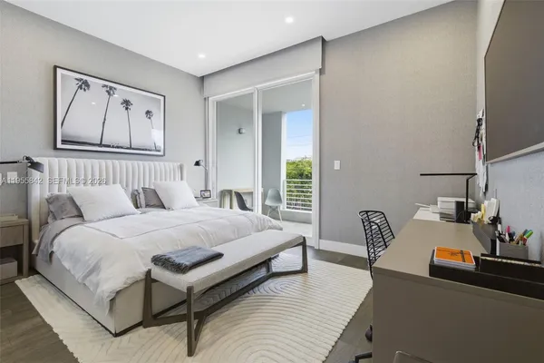 a bedroom with bed and a couch