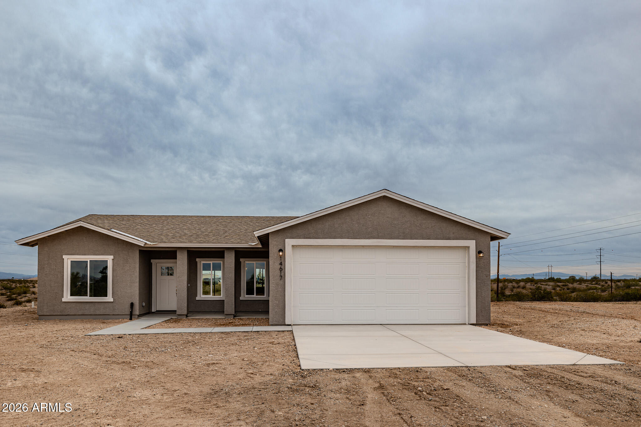 11459 East Adamsville Road Florence, AZ 85132 - Photo 1 of 63 a front view of a house with a yard and garage
