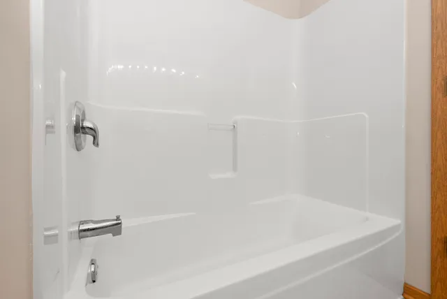 a close view of a bathtub in bathroom