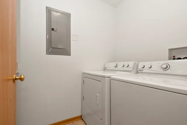 a utility room with sink dryer and washer