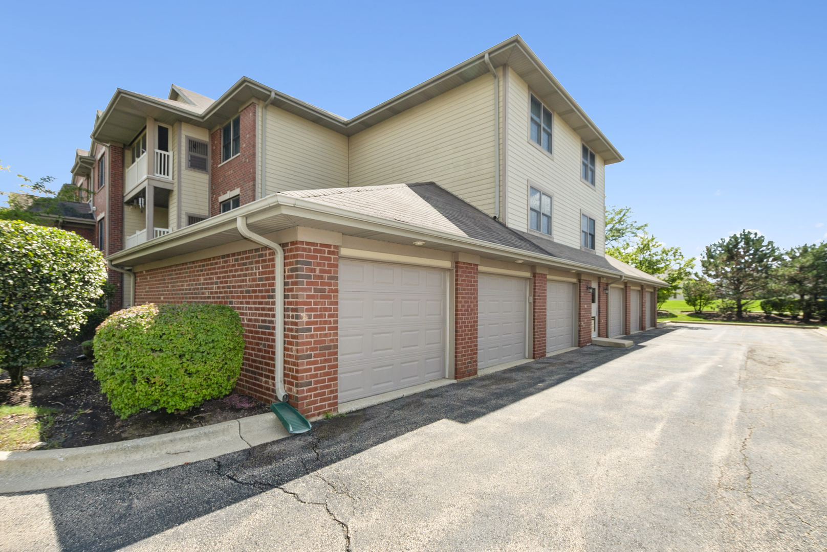 20301 South Pine Hill Road, Unit 1D Frankfort, IL 60423 - Photo 21 of 21 a front view of a house with a yard and garage