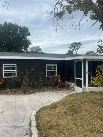 a view of a house with a yard and garage