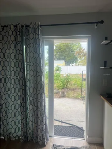a view of a glass door and porch