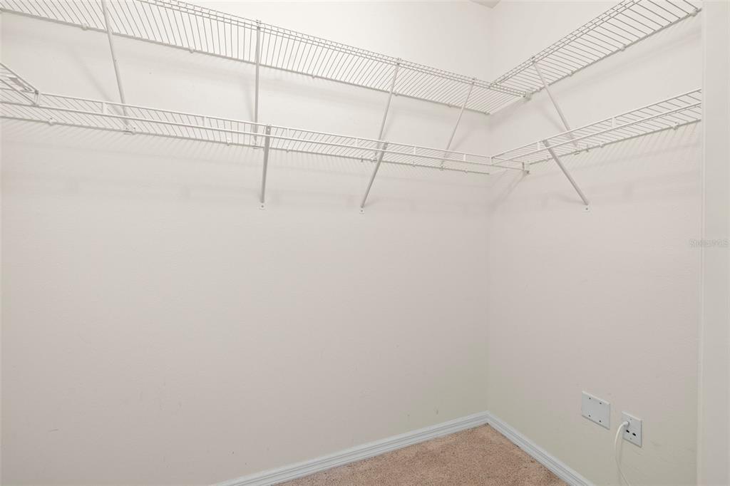 13562 Paddington Way Spring Hill, FL 34609 - Photo 17 of 39 a view of a room with racks on the wall