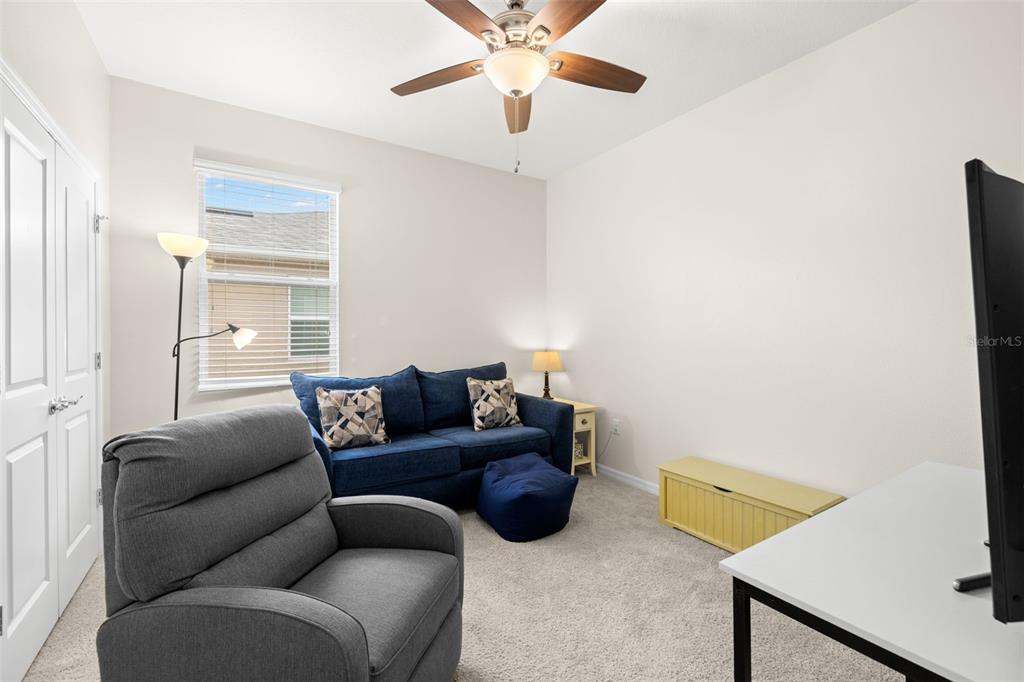 13562 Paddington Way Spring Hill, FL 34609 - Photo 27 of 39 a living room with furniture and a window