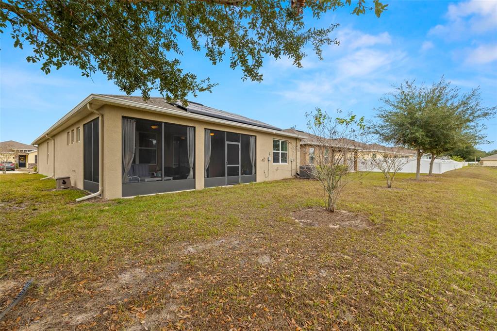 13562 Paddington Way Spring Hill, FL 34609 - Photo 34 of 39 a view of a house with a backyard