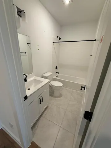 a bathroom with a sink vanity and mirror
