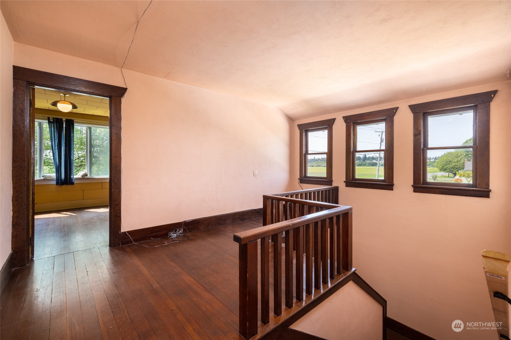 17601 Peterson Road Burlington, WA 98233 - Photo 17 of 36 a view of a hallway with wooden floor and windows