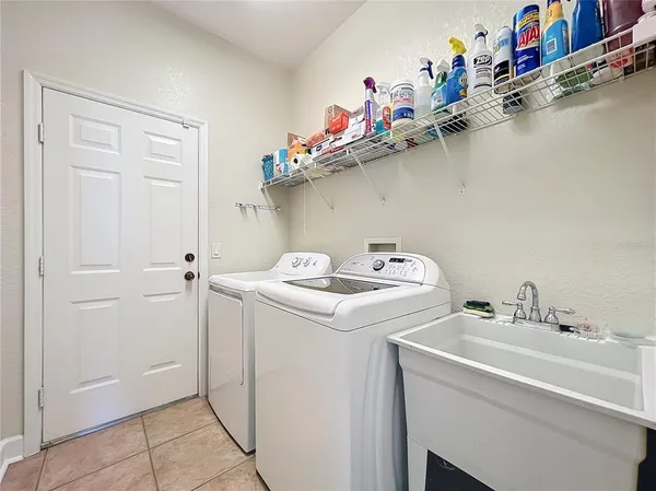 a utility room with dryer and washer