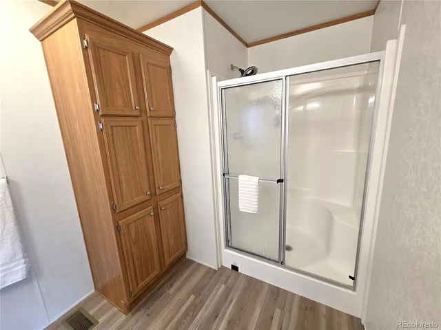 a bathroom with a glass door shower