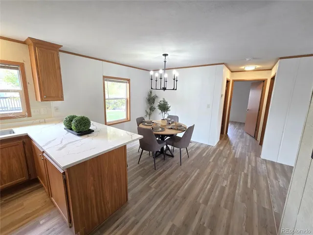 a kitchen with a table and chairs in it