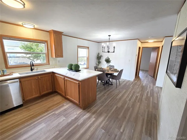 a kitchen with a sink stove and wooden cabinets
